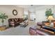 Inviting living room with comfortable seating and a decorative mirror, perfect for relaxation and gatherings at 1622 El Tair Trl, Clearwater, FL 33765