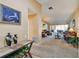 Spacious living room featuring neutral carpeting, comfortable seating, and ample natural light at 1622 El Tair Trl, Clearwater, FL 33765