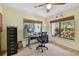 Bright home office space with natural light, desk, and verdant views at 1622 El Tair Trl, Clearwater, FL 33765
