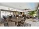 The covered patio boasts a dining set, lounge area, and views of the pool, perfect for outdoor entertaining at 1622 El Tair Trl, Clearwater, FL 33765