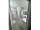 Bathroom featuring lots of space with vanity, sink, tile floors, and white cabinets at 18108 Ashton Park Way, Tampa, FL 33647