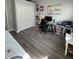 A well lit bedroom featuring a work space, a closet, and gray flooring at 18108 Ashton Park Way, Tampa, FL 33647