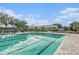 Large community pool with lap lanes and lounge area, perfect for relaxation and exercise at 18108 Ashton Park Way, Tampa, FL 33647