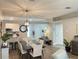 Dining area with modern light fixture and open access to the kitchen at 18108 Ashton Park Way, Tampa, FL 33647