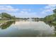 Scenic lake view with a fountain and lush greenery at 18108 Ashton Park Way, Tampa, FL 33647
