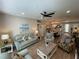 Open-concept living room boasts wood floors and flows into the dining area at 18108 Ashton Park Way, Tampa, FL 33647