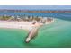 Scenic aerial showcasing beachside condos with white sands and clear gulf waters at 200 1St Ave # 406, St Pete Beach, FL 33706