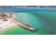 Aerial view of the condo with beach and clear blue water at 200 1St Ave # 406, St Pete Beach, FL 33706