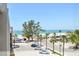 Balcony view with beach and parking area at 200 1St Ave # 406, St Pete Beach, FL 33706