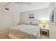 Bedroom with ceiling fan, natural light, and coastal-themed decor at 200 1St Ave # 406, St Pete Beach, FL 33706