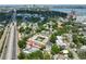 Aerial view of the home and surrounding community featuring nearby highway and lake at 2011 S Carolina Ave, Tampa, FL 33629