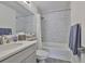 Well-lit bathroom with a white vanity, updated fixtures, and a tiled shower/tub combo at 2011 S Carolina Ave, Tampa, FL 33629