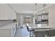 This stylish kitchen features a breakfast bar and sliding glass doors leading to the patio at 2011 S Carolina Ave, Tampa, FL 33629