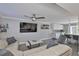 This living room offers stylish furniture, updated fan and flooring, along with seamless kitchen access at 2011 S Carolina Ave, Tampa, FL 33629