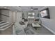 Bright living room boasts stylish furniture, wood-look tile flooring, and contemporary ceiling fan at 2011 S Carolina Ave, Tampa, FL 33629