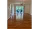 Open layout with a dining area leading to a private balcony with seating at 210 Cypress Ct # 122, Oldsmar, FL 34677