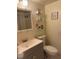 Bathroom with neutral color scheme, stylish shelving, and vanity at 210 Cypress Ct # 122, Oldsmar, FL 34677