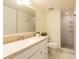 Bathroom featuring a vanity with a white countertop and a tiled shower at 210 Cypress Ct # 122, Oldsmar, FL 34677