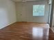 Clean bedroom with ample natural light from the large window at 210 Cypress Ct # 122, Oldsmar, FL 34677