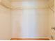 Walk-in closet with wire shelving and wood look flooring at 210 Cypress Ct # 122, Oldsmar, FL 34677