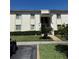Inviting two-story condo building featuring well-maintained landscaping and a charming entrance at 210 Cypress Ct # 122, Oldsmar, FL 34677