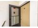 Secure front entry to unit 210 features a glass-paneled storm door and sturdy deadbolt lock at 210 Cypress Ct # 122, Oldsmar, FL 34677