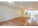 Bright living room with hardwood floors that leads to a modern, fully equipped kitchen at 210 Cypress Ct # 122, Oldsmar, FL 34677