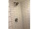 Modern shower with white subway tile and chrome fixtures at 210 Cypress Ct # 122, Oldsmar, FL 34677