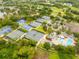 Aerial shot of tennis courts and lush landscaping, part of the community amenities at 210 Cypress Ct # 122, Oldsmar, FL 34677