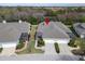 Single-story home with a screened-in lanai, two-car garage, and well-manicured landscaping at 215 Sela Cove Cir, Apollo Beach, FL 33572