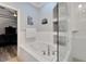 Bathroom featuring a soaking tub and glass enclosed tiled shower at 215 Sela Cove Cir, Apollo Beach, FL 33572