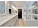 Well-lit bathroom showcases dual sinks, soaking tub, and tiled glass shower at 215 Sela Cove Cir, Apollo Beach, FL 33572