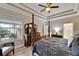 Comfortable primary bedroom with a ceiling fan, a window and nice decor at 215 Sela Cove Cir, Apollo Beach, FL 33572