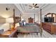 Bedroom featuring a wooden four-poster bed, hardwood floors, and neutral paint at 215 Sela Cove Cir, Apollo Beach, FL 33572