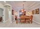 Elegant dining room with a decorative chandelier and ample seating at 215 Sela Cove Cir, Apollo Beach, FL 33572