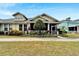 Charming home with a screened porch and colorful landscaping, offering great curb appeal at 215 Sela Cove Cir, Apollo Beach, FL 33572