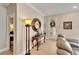 Well-lit hallway area with decorative table and mirror at 215 Sela Cove Cir, Apollo Beach, FL 33572