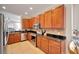 Well-lit kitchen featuring stainless steel appliances and sleek black granite countertops at 215 Sela Cove Cir, Apollo Beach, FL 33572