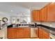 Spacious kitchen with granite countertops and stainless steel appliances open to living area at 215 Sela Cove Cir, Apollo Beach, FL 33572