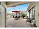 Screened-in lanai with outdoor dining area with views of a landscaped yard at 215 Sela Cove Cir, Apollo Beach, FL 33572
