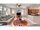 Cozy living room with natural light and views into the modern kitchen at 215 Sela Cove Cir, Apollo Beach, FL 33572