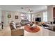 Open-concept living room with tile floors and comfortable seating area at 215 Sela Cove Cir, Apollo Beach, FL 33572