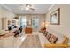 Cozy office with a desk, sofa and natural light streaming through the windows at 215 Sela Cove Cir, Apollo Beach, FL 33572