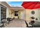 Charming outdoor patio complete with stylish furniture, a grill, and unique decor, ideal for relaxing and entertaining at 215 Sela Cove Cir, Apollo Beach, FL 33572