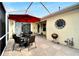 Charming outdoor patio complete with stylish furniture, a grill, and unique decor, ideal for relaxing and entertaining at 215 Sela Cove Cir, Apollo Beach, FL 33572