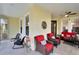 Inviting screened-in porch with comfortable seating, offering a relaxing outdoor living space at 215 Sela Cove Cir, Apollo Beach, FL 33572