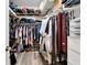 Walk-in closet with lots of clothes, shoes and accessories storage racks at 215 Sela Cove Cir, Apollo Beach, FL 33572