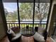 Inviting screened balcony with comfortable seating and serene lake views at 220 Cypress Ln # 220, Oldsmar, FL 34677