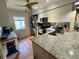 Well-equipped kitchen features granite countertops and stainless steel appliances at 220 Cypress Ln # 220, Oldsmar, FL 34677