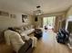 Comfortable living room with a sectional sofa, a recliner, and a balcony at 220 Cypress Ln # 220, Oldsmar, FL 34677
